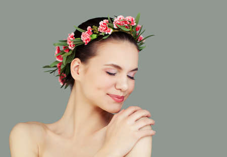 Cute Smiling Woman with Healthy Skin and Flowers on Grey Background, Spa Beautyの写真素材