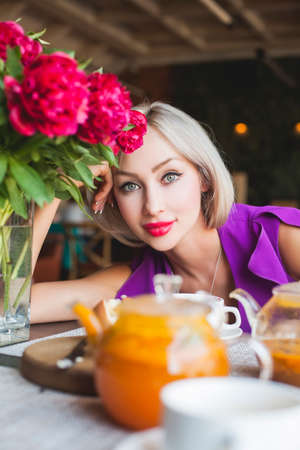 Happy Young Woman in Restaurantの写真素材