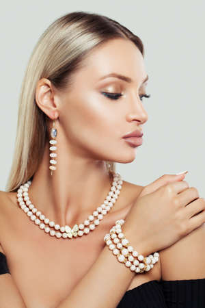Beautiful Woman with Makeup, Long Healthy Hair and Jewelryの写真素材