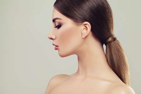 Beautiful Woman Portrait. Female Model Girl with Healthy Skin and Hair. Female Face Closeup, Profileの写真素材