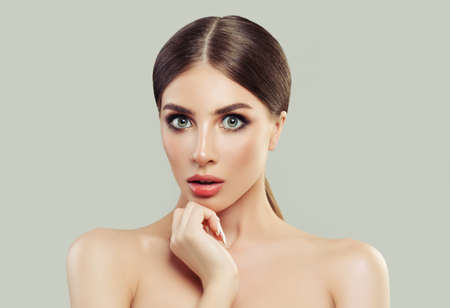 Surprised Woman Spa Model with Clean Fresh Skin and Blonde Hair on White Backgroundの写真素材