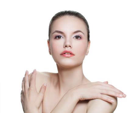 Young woman isolated on white background. Healthy female face with perfect skin. Facial treatment, cosmetology, beauty, skincare and spa conceptの写真素材