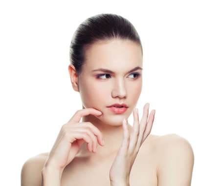 Thinking woman isolated on white background. Spa female model face. Facial treatment, cosmetology and skincareの写真素材