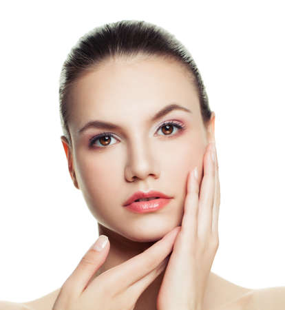 Young woman face isolated on white background. Facial treatment, cosmetology and plastic surgery conceptの写真素材
