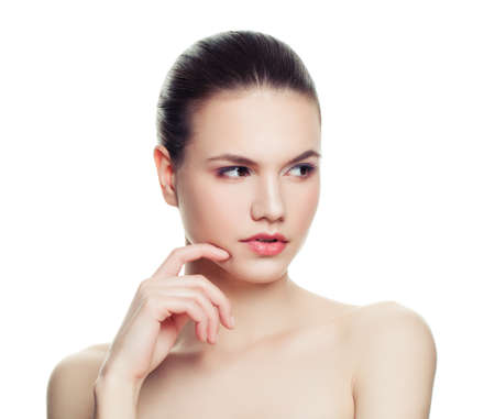 Thinking woman spa model isolated on white background. Beautiful young lady with healthy skin over whiteの写真素材