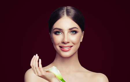 Healthy spa woman with perfect skin and white flower. Facial treatment, cosmetology and spa beautyの写真素材