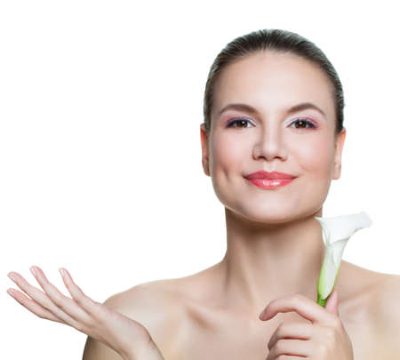 Healthy woman with flowers and empty copy space on the open hand isolated on white background. Presenting your productの写真素材