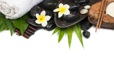 spa objects with candle and towel ready for therapy on white wellness tableの写真素材