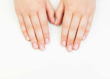 Beautiful female hands. Manicure concept  on white backgroundの写真素材