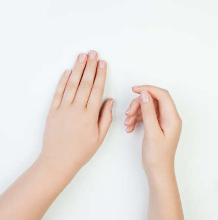 Manicure concept female hands on white background.の写真素材