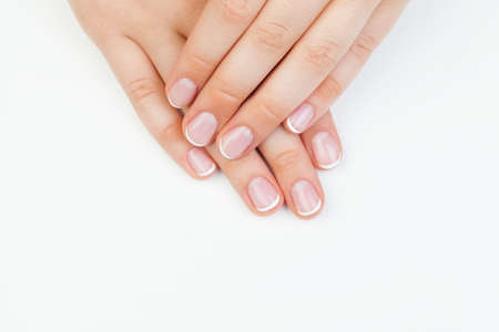 Beautiful female hands. Manicured hands on white backgroundの写真素材