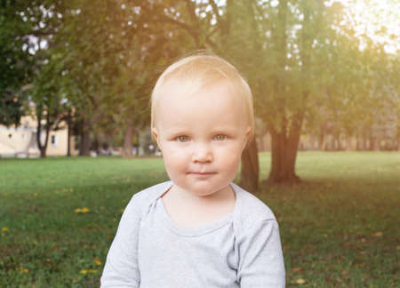 Little baby boy portrait. Cute child outdoorの写真素材