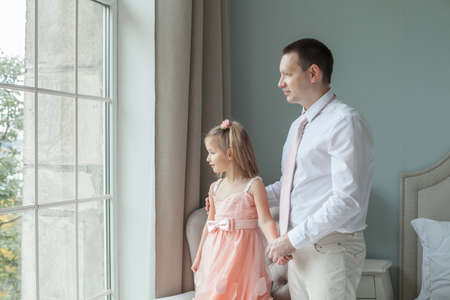 Dad and daughter together at homeの写真素材