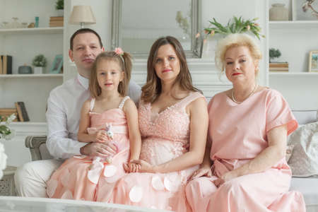 Grandmother and mother, daughter, father. Happy familyの写真素材