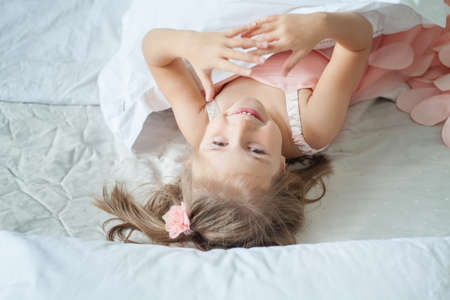 Happy child girl portrait, top viewの写真素材