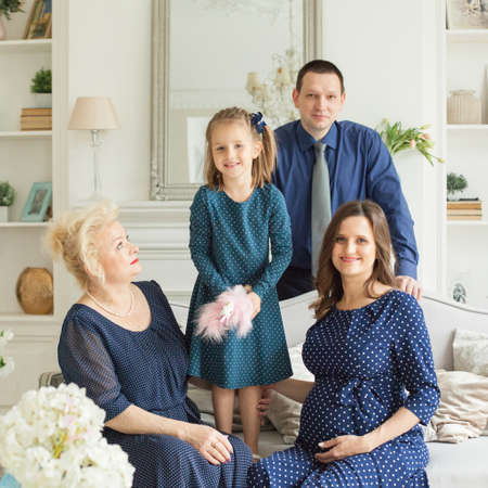 Big family. Happy mother, daughter, father and grandmotherの写真素材