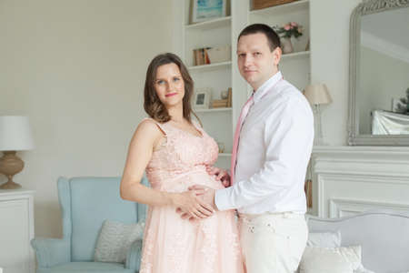 Happy pregnant couple. Pregnancy, maternity, preparation and expectation conceptの写真素材