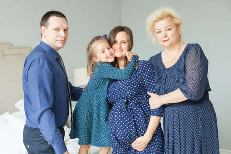 Family at home. Mother, daughter, father and grandmotherの写真素材