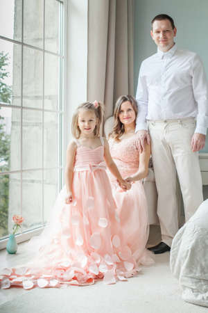 Family. Happy mother, father, child daughter at homeの写真素材