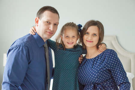 Mother, father and child daughter. Happy familyの写真素材
