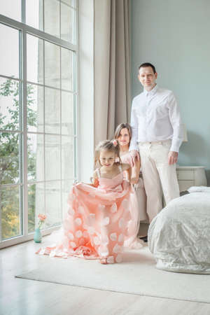 Family home. Happy family, mother, father, child daughterの写真素材