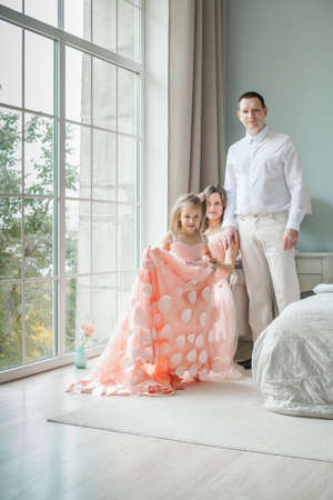 happy family indoor. Mother, father, child daughter at homeの写真素材