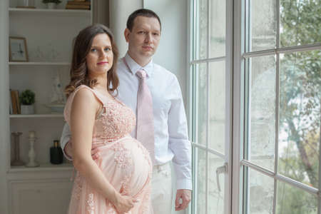 Pregnant couple. Pregnancy, maternity, preparation and expectation conceptの写真素材