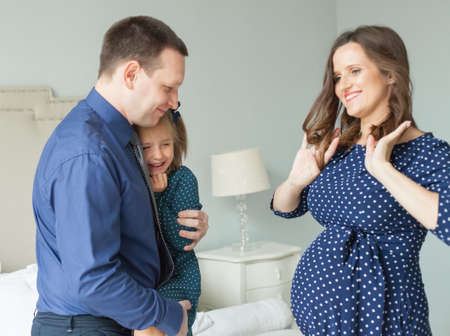 Happy family. Mother, father and child having fun at home