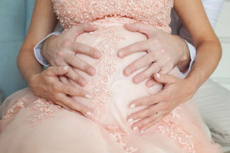 Pregnant belly. Parental love and care conceptの写真素材