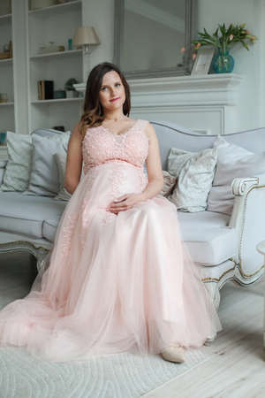 Pregnant woman portrait. Pregnancy, maternity, preparation and expectation conceptの写真素材