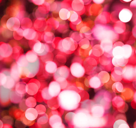 Red sparkle background with abstract bokeh glitter lightの写真素材