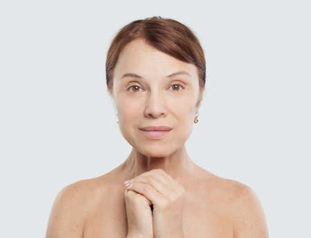 Mature woman female model with perfect natural skin. Facial treatment, cosmetology, aesthetic medicine and plastic surgeryの写真素材
