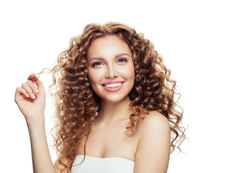 Beautiful woman with healthy wavy hair isolated on white. Haircare conceptの写真素材
