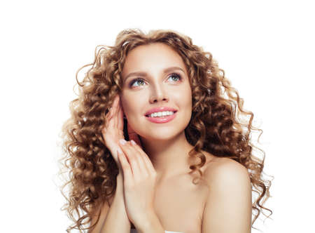 Beautiful female face. Happy woman looking up isolated on whiteの写真素材