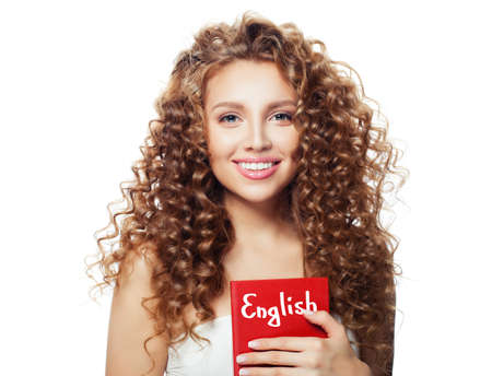 Happy woman student with English book isolated on whiteの写真素材