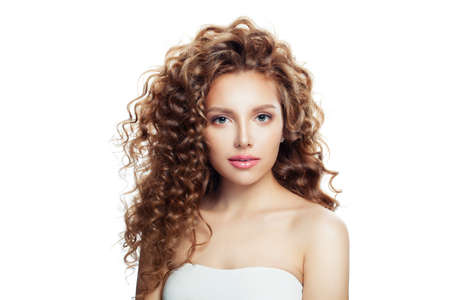 Isolated woman with healthy skin and perfect wavy hair.の写真素材