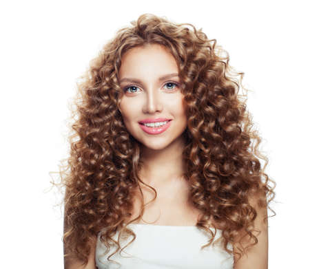 Beautiful smiling girl. Healthy woman with wavy hairstyle isolated on whiteの写真素材