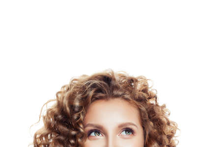Happy woman looking up isolated on white.