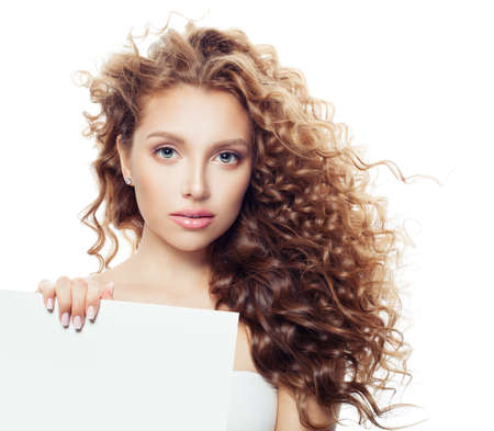 Perfect fashion model woman with white empty paper board background with copy space for advertising marketing or product placementの写真素材
