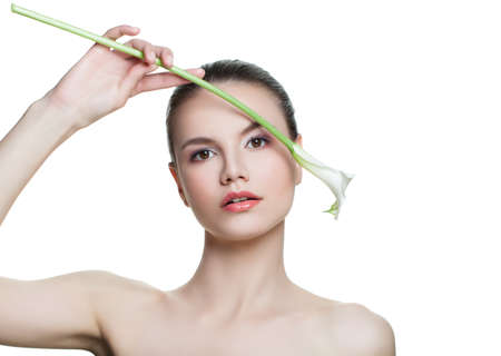 Perfect spa woman with flower isolated on white background. Beautiful female model face. Facial treatment, cosmetology, beauty, skin care and spa conceptの写真素材
