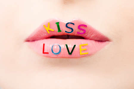 Pink lips macro. Female mouth with creative make up. Valentine's day, love and passion conceptの写真素材
