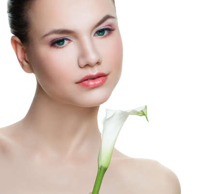 Attractive young woman isolated. Beautiful female face close upの写真素材
