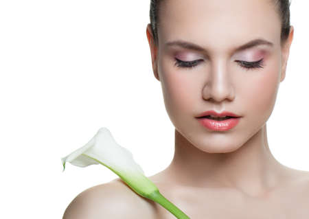 Spa woman portrait. Young face with flower isolatedの写真素材