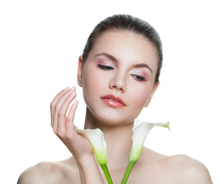 Ferfect face. Cute spa woman with flower isolated on white backgroundの写真素材