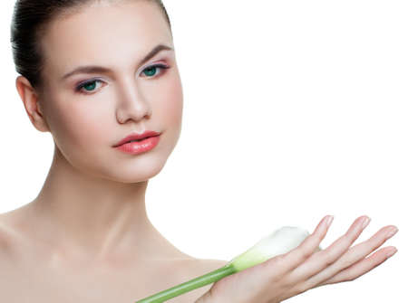 Perfect young woman holding calla lily flower isolated on white backgroundの写真素材