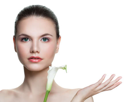 Spa woman showing empty copy space on the open hand isolated on white background. Skincare and wellness concept. Presenting your productの写真素材