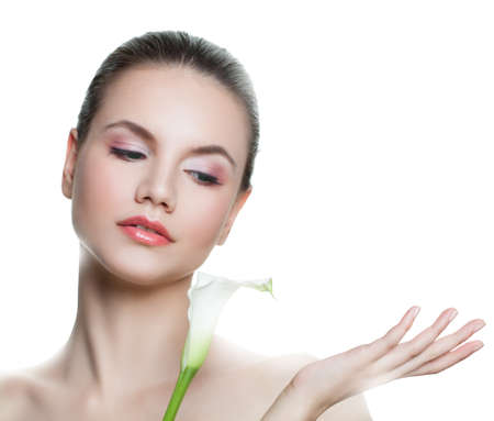 Cute young woman with empty copy space on the open hand isolated on white. Skincare and wellness concept. Presenting your productの写真素材
