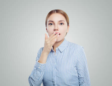 Surprised business woman or student on whiteの写真素材