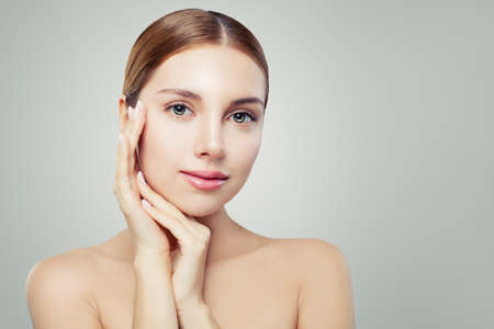 Beautiful spa woman face. Pretty girl with healthy clear skin. Facial treatment, skincare and cosmetology concept. の写真素材