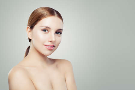 Young perfect woman. Beautiful girl with healthy clear skin. Facial treatment, skincare and cosmetology concept.の写真素材
